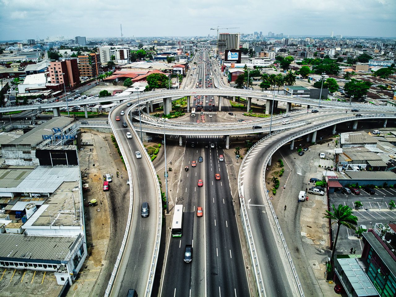 About High-angle view of a busy expressway in Abidjan, showcasing urban infrastructure and traffic.